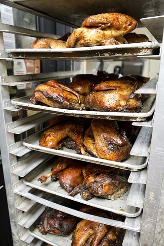 Racks of freshly smoked turkeys